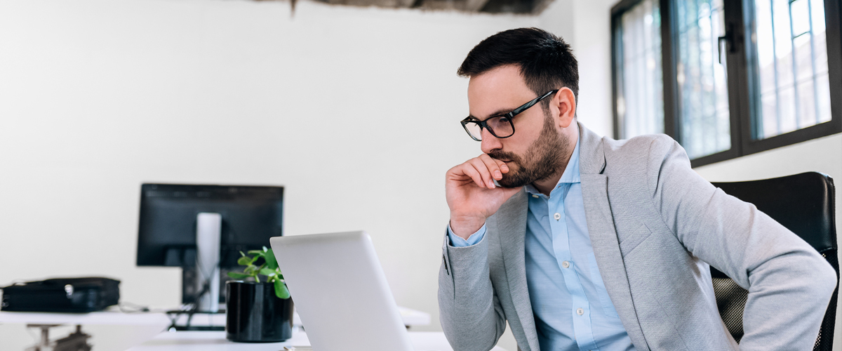 Man staring at laptop